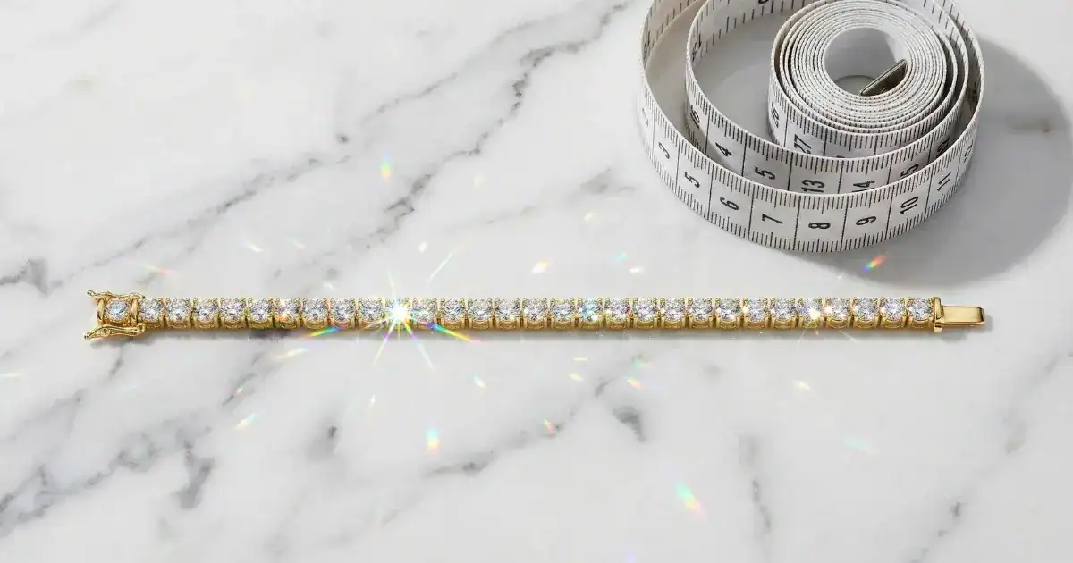 Bracelet Size Chart: Essential Guide with CM to Inches Conversion Bracelet size chart with diamond tennis bracelet and measuring tape