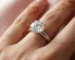 3 carat diamond ring showing size and brilliance on woman's hand