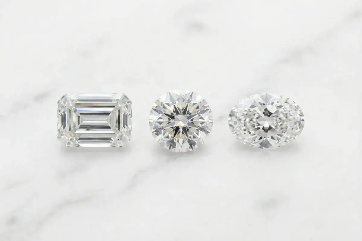 Emerald cut vs round cut vs oval cut diamond comparison side by side
