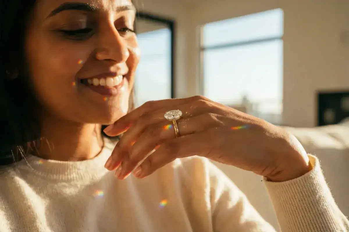 Woman wearing oval cut labgrown diamond engagement ring